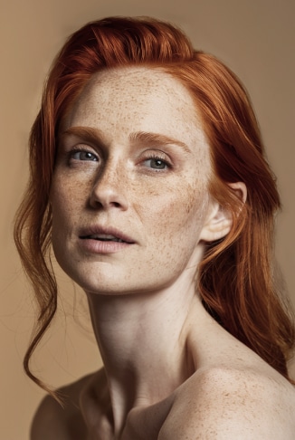 Fifteen Twelve Salon a beautiful redhead woman showcasing her natural beauty
